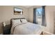 Cozy bedroom with natural light, comfortable bedding, and tranquil decor for a restful sanctuary at 7604 Reed St, Arvada, CO 80003