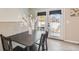Cozy dining space with natural light and access to the backyard at 7604 Reed St, Arvada, CO 80003