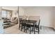 Bright dining area with modern table and chairs next to the living room at 7604 Reed St, Arvada, CO 80003