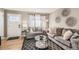 Inviting living room features a cozy seating area, stylish rug, and modern decor, perfect for relaxation and entertaining at 7604 Reed St, Arvada, CO 80003