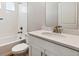 Clean bathroom with single vanity, bathtub, and shower at 1224 Sugarloaf Ln, Erie, CO 80516
