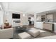 Living room features a modern fireplace and an open floor plan at 1224 Sugarloaf Ln, Erie, CO 80516