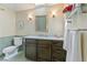 Cozy bathroom with modern vanity, marble countertop, and stylish sconces providing warm, inviting light at 481 N Humboldt St, Denver, CO 80218