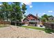 The backyard features a patio, hot tub, lawn, privacy fence, and a landscaped rock garden at 8051 W 78Th Cir, Arvada, CO 80005
