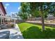 Beautiful backyard with a lush lawn, mature trees, and an outdoor seating area at 8051 W 78Th Cir, Arvada, CO 80005