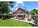 A beautiful backyard features a well-manicured lawn, hot tub, patio with outdoor furniture, and a privacy fence at 8051 W 78Th Cir, Arvada, CO 80005