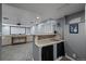Basement living area with a bar, projector, and comfortable seating at 8051 W 78Th Cir, Arvada, CO 80005