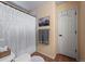 Full bathroom with a shower, toilet, and towel rack with gray towels at 8051 W 78Th Cir, Arvada, CO 80005