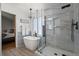 Elegant bathroom with modern tub, walk-in shower, and natural light for a serene and spa-like experience at 8051 W 78Th Cir, Arvada, CO 80005