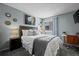 Comfortable bedroom featuring a bed, nightstand, and a window at 8051 W 78Th Cir, Arvada, CO 80005