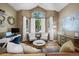 Bright living room with stylish decor, hardwood floors, and vaulted ceilings at 8051 W 78Th Cir, Arvada, CO 80005