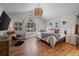 Vaulted ceiling bedroom with a comfy bed, wood floors, decor, and a window at 8051 W 78Th Cir, Arvada, CO 80005