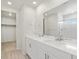 Double vanity in bathroom boasts modern fixtures, walk-in closet, and shower at 552 Red Rock Pl, Brighton, CO 80601
