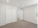 A bedroom offers sliding closet doors, a window, and recessed lighting at 552 Red Rock Pl, Brighton, CO 80601