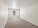 A light and airy bedroom features neutral carpeting and recessed lighting at 552 Red Rock Pl, Brighton, CO 80601