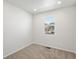 Bright bedroom with neutral carpet, natural light from window, and white walls at 552 Red Rock Pl, Brighton, CO 80601
