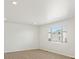 Bright bedroom with large window and neutral walls at 552 Red Rock Pl, Brighton, CO 80601