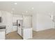 Modern kitchen featuring stainless appliances, a large island, and an open layout at 552 Red Rock Pl, Brighton, CO 80601