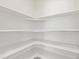 Walk-in pantry featuring built-in shelving at 552 Red Rock Pl, Brighton, CO 80601