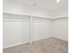Spacious walk-in closet with shelving and plush carpeting at 552 Red Rock Pl, Brighton, CO 80601