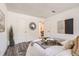 Comfortable bedroom with modern decor, hardwood floors, and a cozy atmosphere at 10211 Ura Ln # 7-204, Thornton, CO 80260