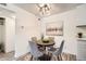 Cozy dining area showcasing modern lighting, comfortable seating, and stylish decor at 10211 Ura Ln # 7-204, Thornton, CO 80260