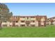 Inviting two-story townhome with a well-manicured lawn and multiple balconies at 10211 Ura Ln # 7-204, Thornton, CO 80260