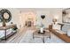 Bright living room offering open access to dining area, modern gray floors, and stylish decor at 10211 Ura Ln # 7-204, Thornton, CO 80260