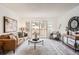 Cozy living room with a sliding glass door, modern furnishings, and tasteful decorations at 10211 Ura Ln # 7-204, Thornton, CO 80260