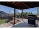 Enjoy a covered patio with a built-in grill, perfect for entertaining guests at 11918 S Hitching Post Trl, Parker, CO 80134