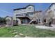 Large, level backyard featuring a patio and deck perfect for outdoor entertaining at 11918 S Hitching Post Trl, Parker, CO 80134