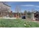 Backyard with a shed, patio, and lush lawn provides ample space for recreation at 11918 S Hitching Post Trl, Parker, CO 80134