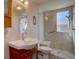 Bathroom featuring a glass-enclosed shower, modern sink, and updated fixtures at 11918 S Hitching Post Trl, Parker, CO 80134