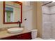 Bathroom featuring decorative mirror, vanity, granite countertop, and tiled walk-in shower at 11918 S Hitching Post Trl, Parker, CO 80134