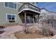 Charming backyard view with a spacious deck, patio, and landscaped yard at 11918 S Hitching Post Trl, Parker, CO 80134