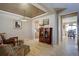 Spacious living room with hardwood floors, decorative ceiling, and seamless transition to the dining area at 11918 S Hitching Post Trl, Parker, CO 80134