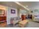 Cozy living room featuring a comfortable couch, coffee table, and access to a full bathroom at 11918 S Hitching Post Trl, Parker, CO 80134