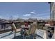 Outdoor patio featuring comfortable seating, patio rug and views of the neighborhood at 11918 S Hitching Post Trl, Parker, CO 80134