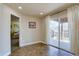 Flex room with tile floor, neutral walls, access to patio, and hall access to other rooms at 11918 S Hitching Post Trl, Parker, CO 80134