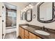 Double sink bathroom featuring tile backsplash and shower at 18225 E Caley Dr, Aurora, CO 80016