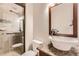 Updated bathroom with glass enclosed shower, granite countertops, and decorative tile at 18225 E Caley Dr, Aurora, CO 80016