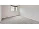 Carpeted bedroom with baseboard trim and lots of light at 18225 E Caley Dr, Aurora, CO 80016