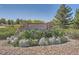 Stone entrance sign for Creekside Park, enhanced by colorful flower beds and neatly arranged gravel at 18225 E Caley Dr, Aurora, CO 80016