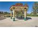 Community gazebo with picnic tables, offering a shaded area for outdoor gatherings and relaxation at 18225 E Caley Dr, Aurora, CO 80016