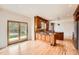 Gourmet kitchen with custom wood cabinetry, granite countertops, and stainless steel appliances at 18225 E Caley Dr, Aurora, CO 80016