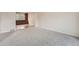 Spacious living area featuring neutral carpeting, bright natural light, and hardwood flooring at 18225 E Caley Dr, Aurora, CO 80016
