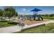 Community playground featuring a large play structure with slides and climbing area for neighborhood children to enjoy at 18225 E Caley Dr, Aurora, CO 80016