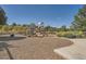 Community playground featuring various play structures and equipment, nestled in a natural setting at 18225 E Caley Dr, Aurora, CO 80016