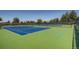 Well-maintained community tennis courts with vibrant blue and green surfaces, perfect for recreational games and friendly matches at 18225 E Caley Dr, Aurora, CO 80016