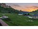 Expansive backyard with green grass and stunning views of the mountains at 6402 Wauconda Dr, Larkspur, CO 80118